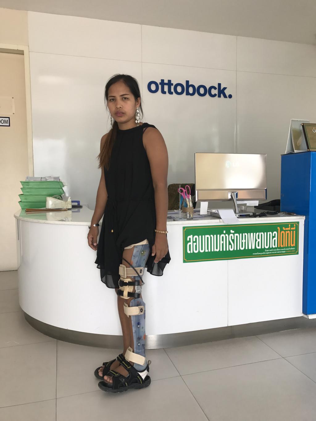 Krang Sreang - Pen wearing her high-tech leg brace