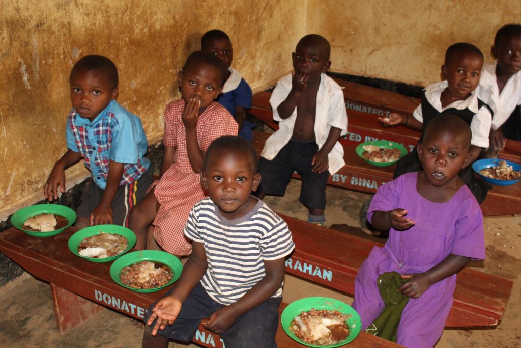 Children having their evening meal in their classroom